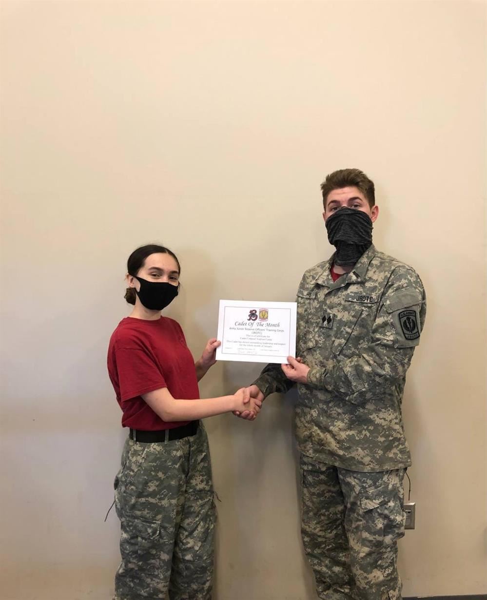 BNC, Cole Broadhead, shaking hands with the Cadet of the Month, Xadrien Carter.